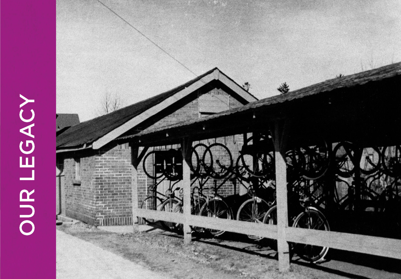 Black and white photo of the old bicycle shed that KWAG used to be housed in. Bicycles are hanging vertically.