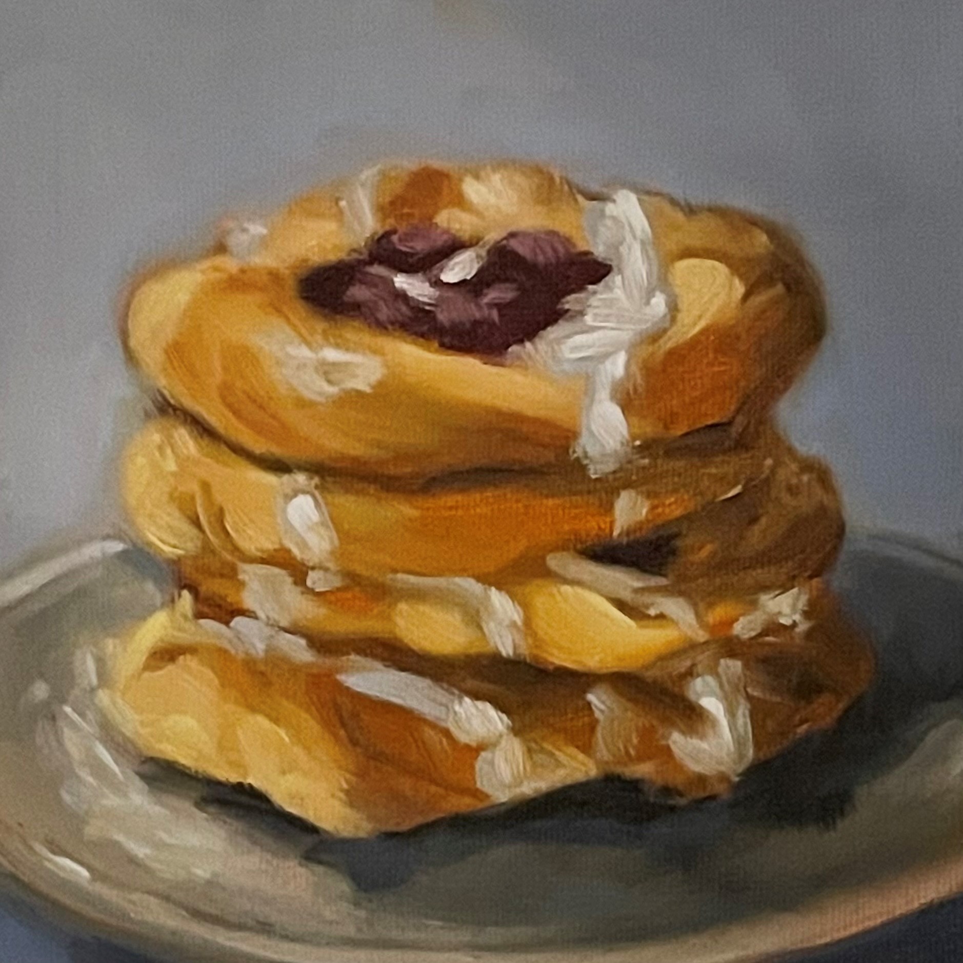 An oil painting of a stack of three sticky-looking danishes with dark berry centres