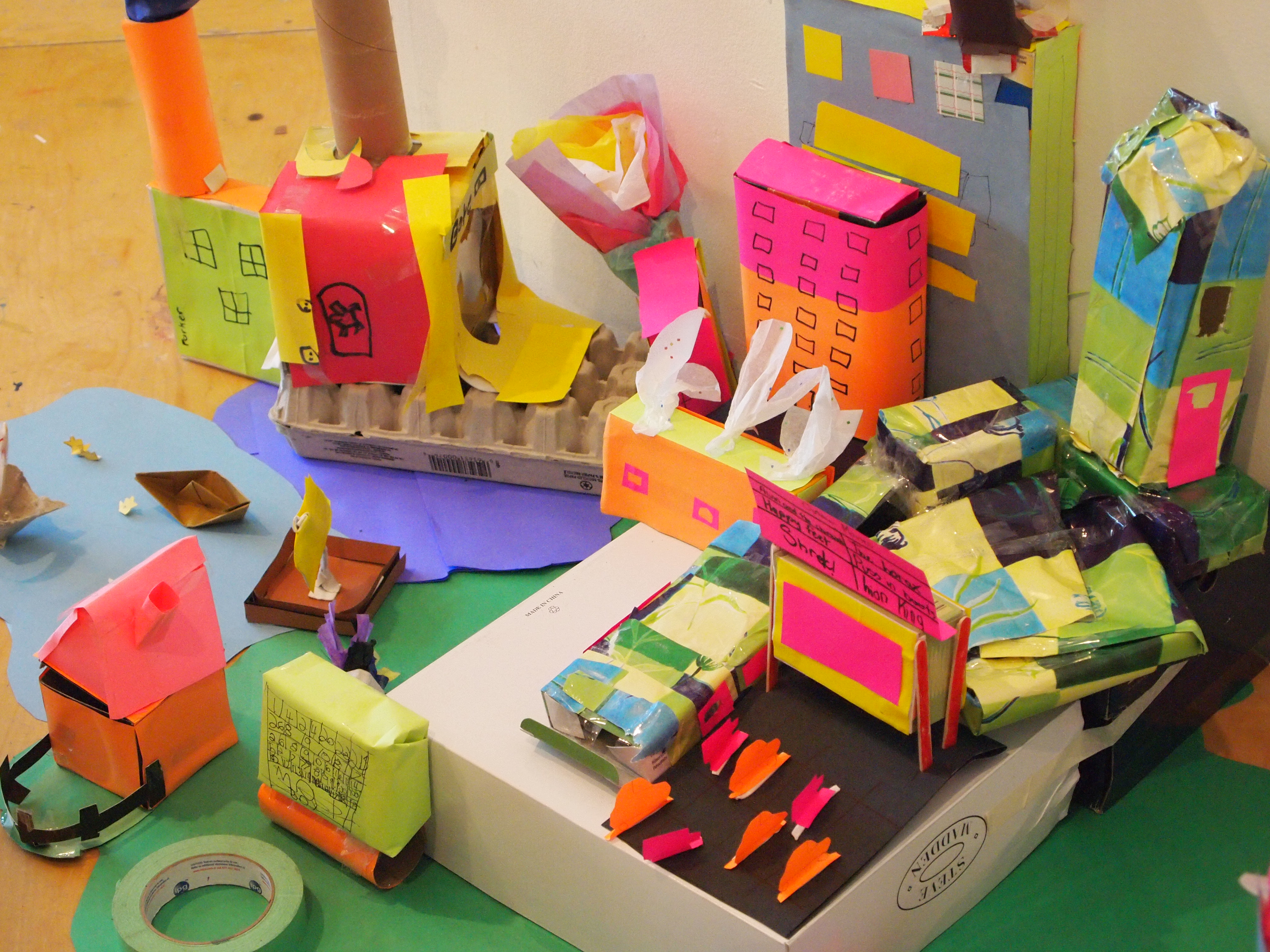 Brightly coloured craft paper in the shape of city buildings