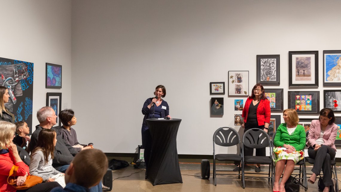 View of the speaker making remarks for the reception of the Expressions exhibition