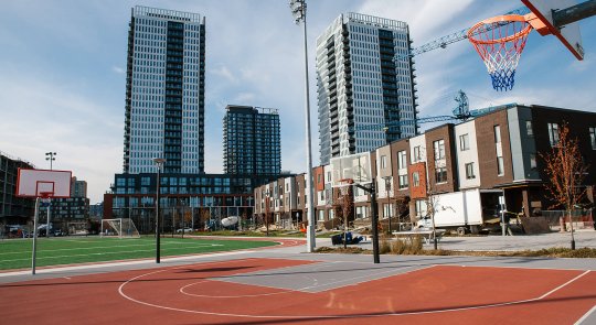 photo showing the recreational courts amongst the Regent Park Revitalized mixed income dwellings