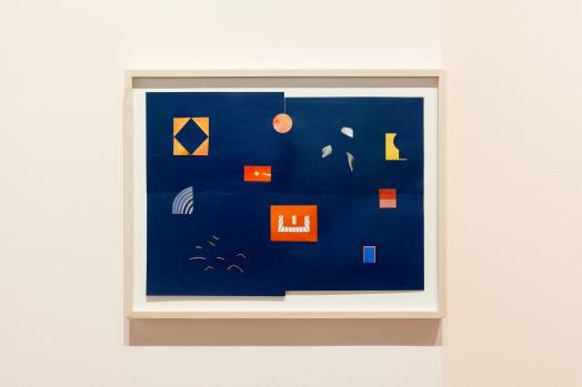 Maggie Groat`s Alternative Guide to SET, a framed paper collage of brightly coloured shapes sparsely arranged on a deep blue background assembled from four pieces of paper