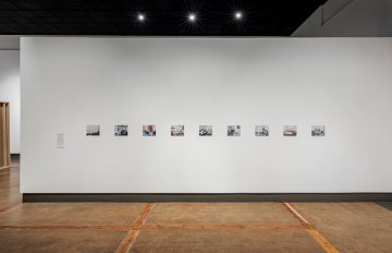 Image of wall covered with black and white imagery