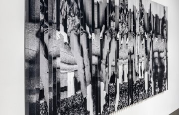 Image of wall covered with black and white imagery