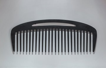 Large comb hung on a wall