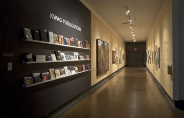 installation view of exhibition in a long hallway