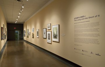 installation view of exhibition in a long hallway