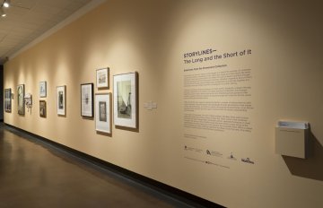 installation view of exhibition in a long hallway