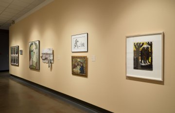 installation view of exhibition in a long hallway