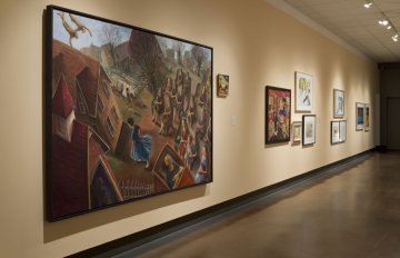 installation view of exhibition in a long hallway