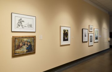 installation view of exhibition in a long hallway