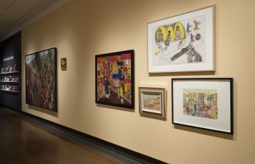 installation view of exhibition in a long hallway