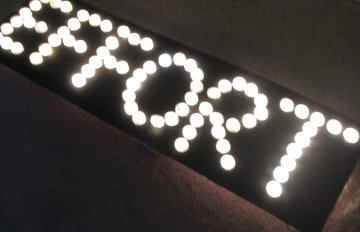 photo of a lit up sign that says effor