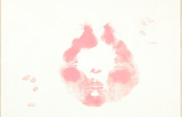 imprint of lips in pink ink on a blank canvas