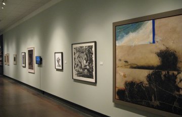 gallery shot of exhibition in long corridor