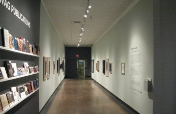 gallery shot of exhibition in long corridor