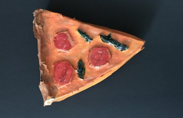 sculpture of a pizza with pepperoni on it