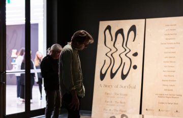 large SOS exhibition signage