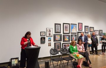 View of the speaker making remarks for the reception of the Expressions exhibition