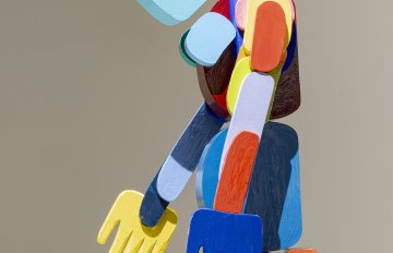 Close-up of a wooden, sculpture of a figure made up on ovoid shapes