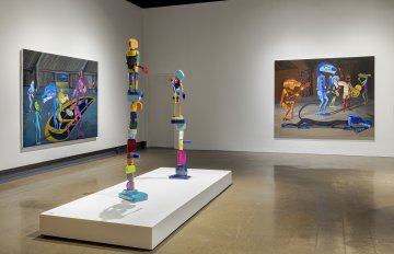 Installation shot featuring paintings and sculptures