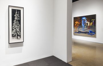 Installation shot featuring paintings and sculptures