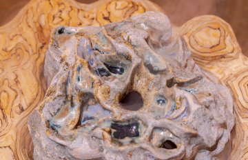 Close-up of the sculpture on the ground emitting a scent.