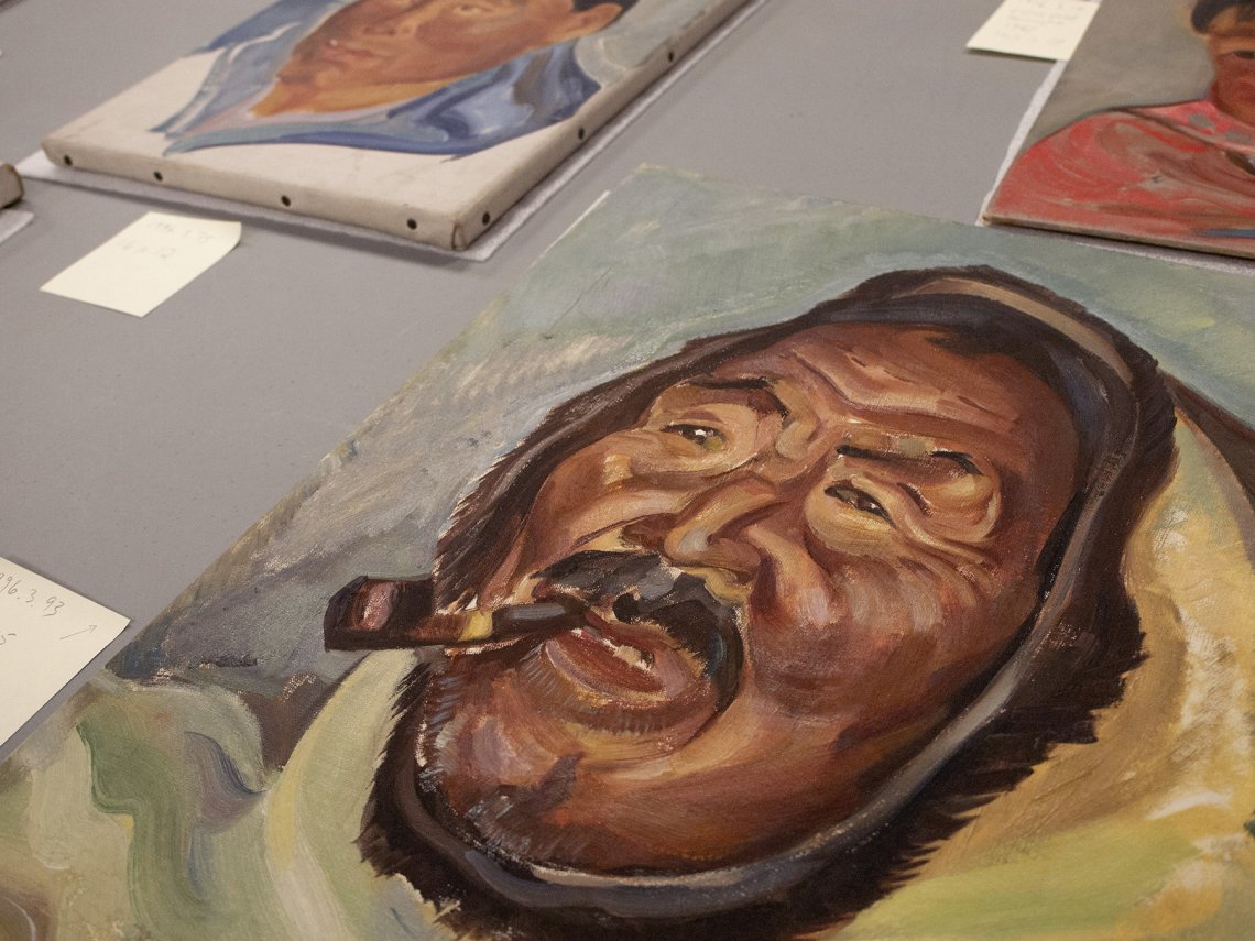 View from above of an oil painting of an Inuit man 
