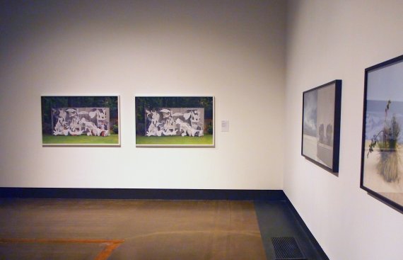 installation shot of four pictures hanging on white gallery walls