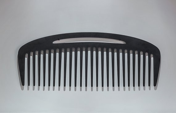 Large comb hung on a wall